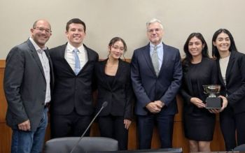 The Chicago-Kent trial advocacy team poses with Judge Merchan